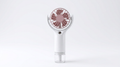 ArcticMist handheld misting fan — real product, white body with pink blades and clear water tank